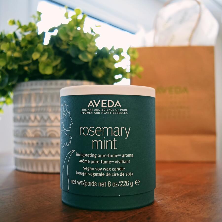 Close-up of an Aveda Rosemary Mint vegan soy wax candle