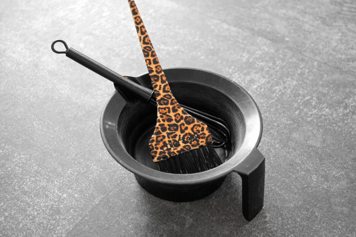 Professional hair coloring tools and mixing bowl