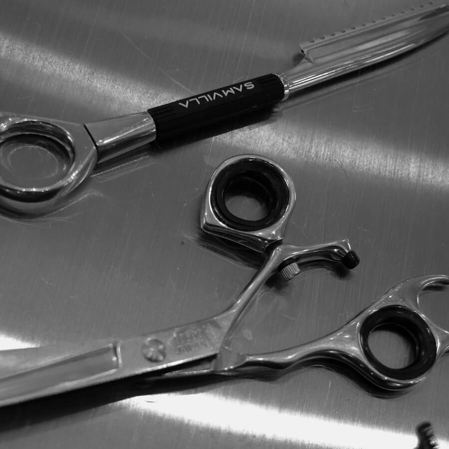 Black and white close-up of professional hair cutting tools